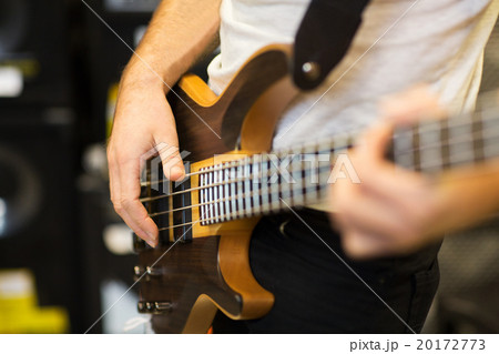 close up of musician with guitar at music studio close up of musician with guitar at music studio 20172773