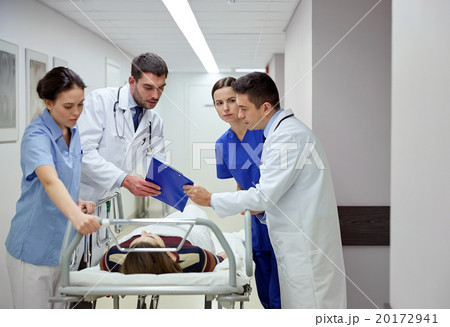 medics and patient on hospital gurney at emergency 20172941