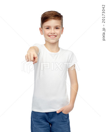 happy boy in white t-shirt pointing finger to you 20173042