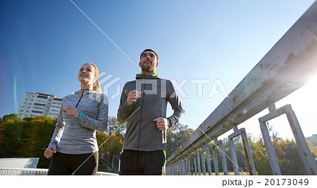 happy couple running outdoors happy couple running outdoors 20173049