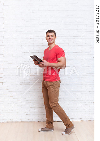 Man Using Tablet Computer Busy Walking Over Wall Man Using Tablet Computer Busy Walking Over Wall 20173217