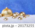 gold Christmas balls in the snow 20173255