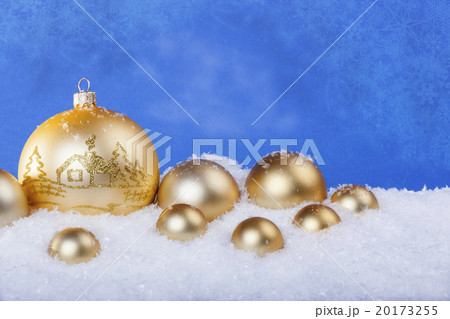 gold Christmas balls in the snow 20173255