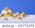 gold Christmas balls in the snow 20173258