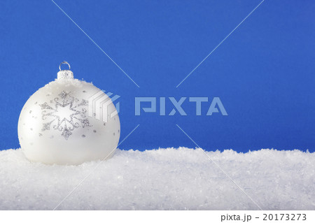 white Christmas balls in the snow 20173273