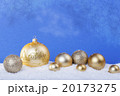 gold Christmas balls in the snow 20173275