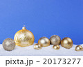 gold Christmas balls in the snow 20173277