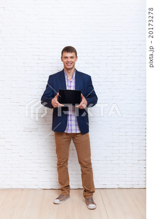 Young Business Man Holding Laptop Tablet Computer 20173278
