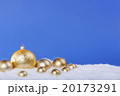 gold Christmas balls in the snow 20173291