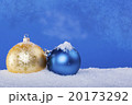 gold Christmas balls in the snow 20173292