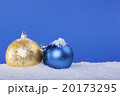 gold Christmas balls in the snow 20173295