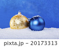 gold Christmas balls in the snow 20173313
