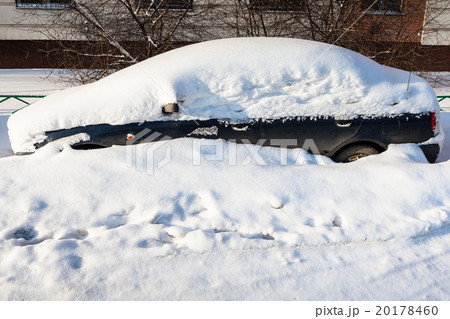 side view of black car covered with snow side view of black car covered with snow 20178460