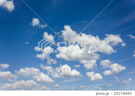 Beautiful light blue sky with puffy white clouds 20178485