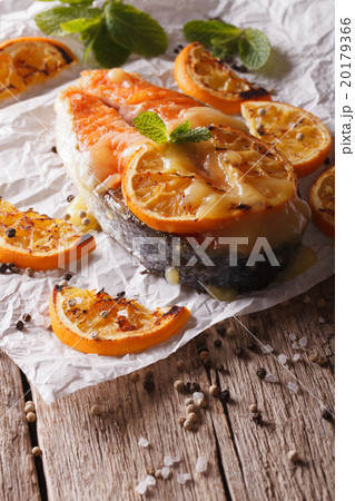 baked salmon steak with oranges on baking paper baked salmon steak with oranges on baking paper 20179366