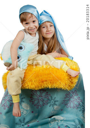 Cute girls in blue sleeping hats isolated on white Cute girls in blue sleeping hats isolated on white 20183314