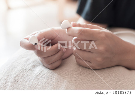 Hand holding earphone Hand holding earphone 20185373