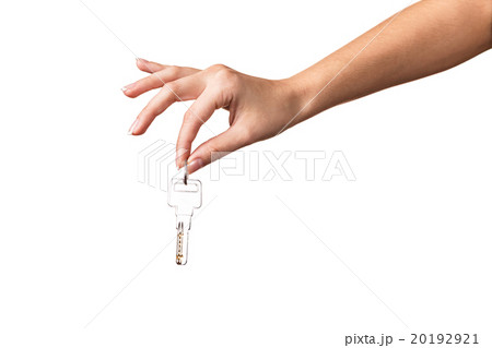Woman's hand giving keys 20192921