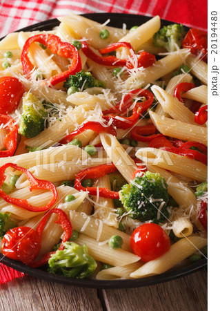 Pasta Penne Primavera with vegetables close-up 20194480