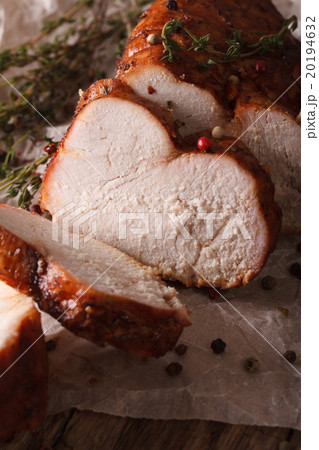 Delicious sliced roasted turkey close-up on paper Delicious sliced roasted turkey close-up on paper 20194632