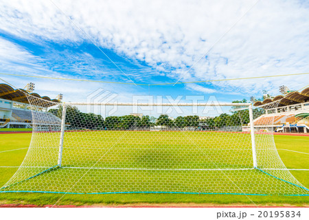 Football field with green grass at sunny day Football field with green grass at sunny day 20195834