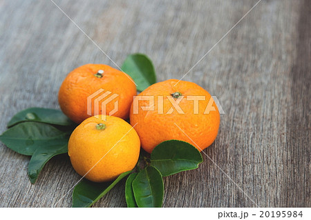 Organic orange on wooden board Organic orange on wooden board 20195984