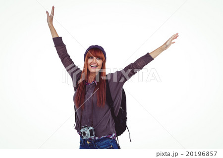 Smiling hipster woman with hands up 20196857