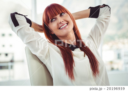 Hipster businesswoman with outstretched arms Hipster businesswoman with outstretched arms 20196939