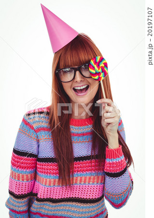 Smiling hipster woman with lollipop and hat party Smiling hipster woman with lollipop and hat party 20197107