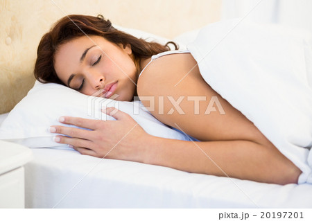 Sleepy woman in her bed 20197201