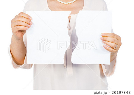 Woman holding ripped page 20197348