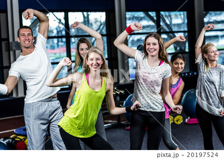 Fit group dancing and smiling Fit group dancing and smiling 20197524