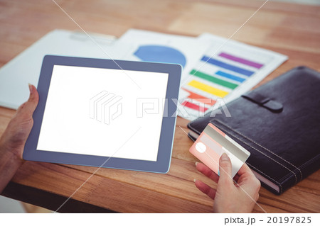 Over shoulder view of hipster woman using tablet 20197825