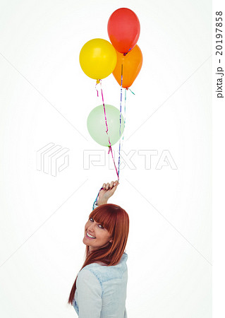 Smiling hipster woman holding balloons Smiling hipster woman holding balloons 20197858