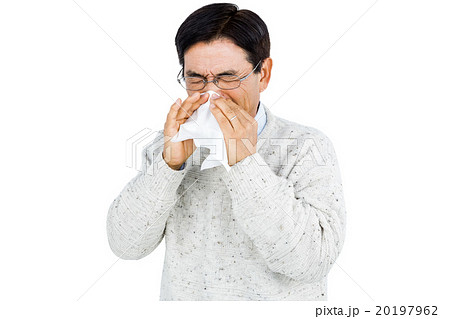 Smiling man using a tissue Smiling man using a tissue 20197962