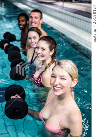 Fit people doing an aqua aerobics class Fit people doing an aqua aerobics class 20198127