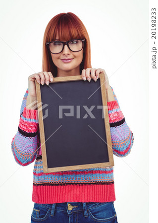 Smiling hipster woman holding blackboard Smiling hipster woman holding blackboard 20198233