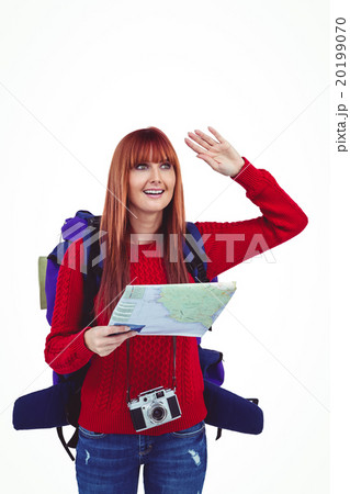 Smiling hipster woman with a travel bag with a map Smiling hipster woman with a travel bag with a map 20199070