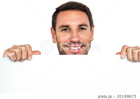 Smiling man holding blank sheet 20199675