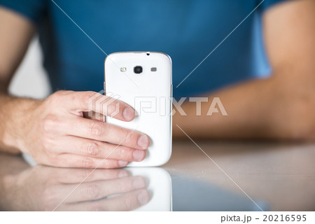 Man with smartphone 20216595