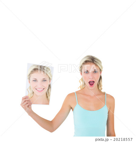 Woman showing picture of herself Woman showing picture of herself 20218557