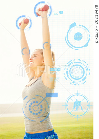 Composite image of smiling sporty blonde lifting dumbbells  20219479