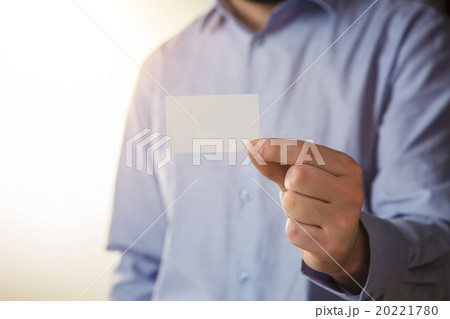 Man holding white business card  20221780