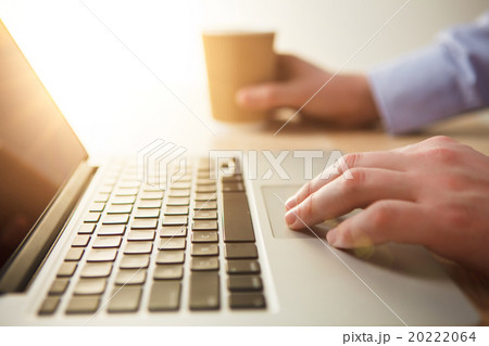 The hand on the keyboard and coffee The hand on the keyboard and coffee 20222064