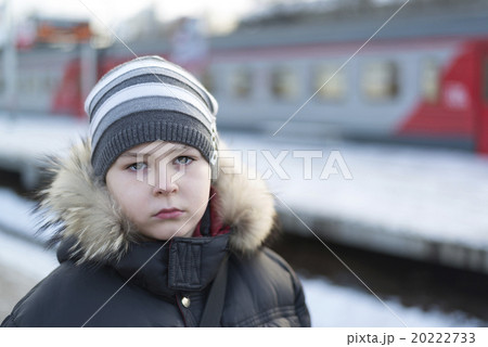 Teen boy on  platform of train background 20222733