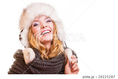 Winter fashion girl in fur hat doing fun isolated Winter fashion girl in fur hat doing fun isolated 20225287