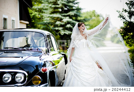 Bride and groom in car Bride and groom in car 20244412