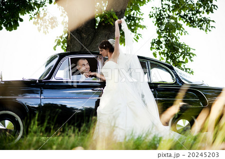 Bride and groom in car Bride and groom in car 20245203