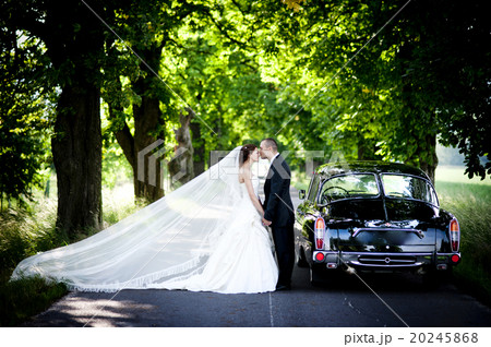 Bride and groom in car Bride and groom in car 20245868