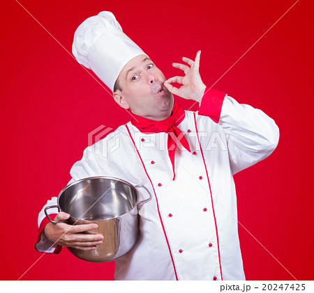 chef holding a pot with gesture okay 20247425